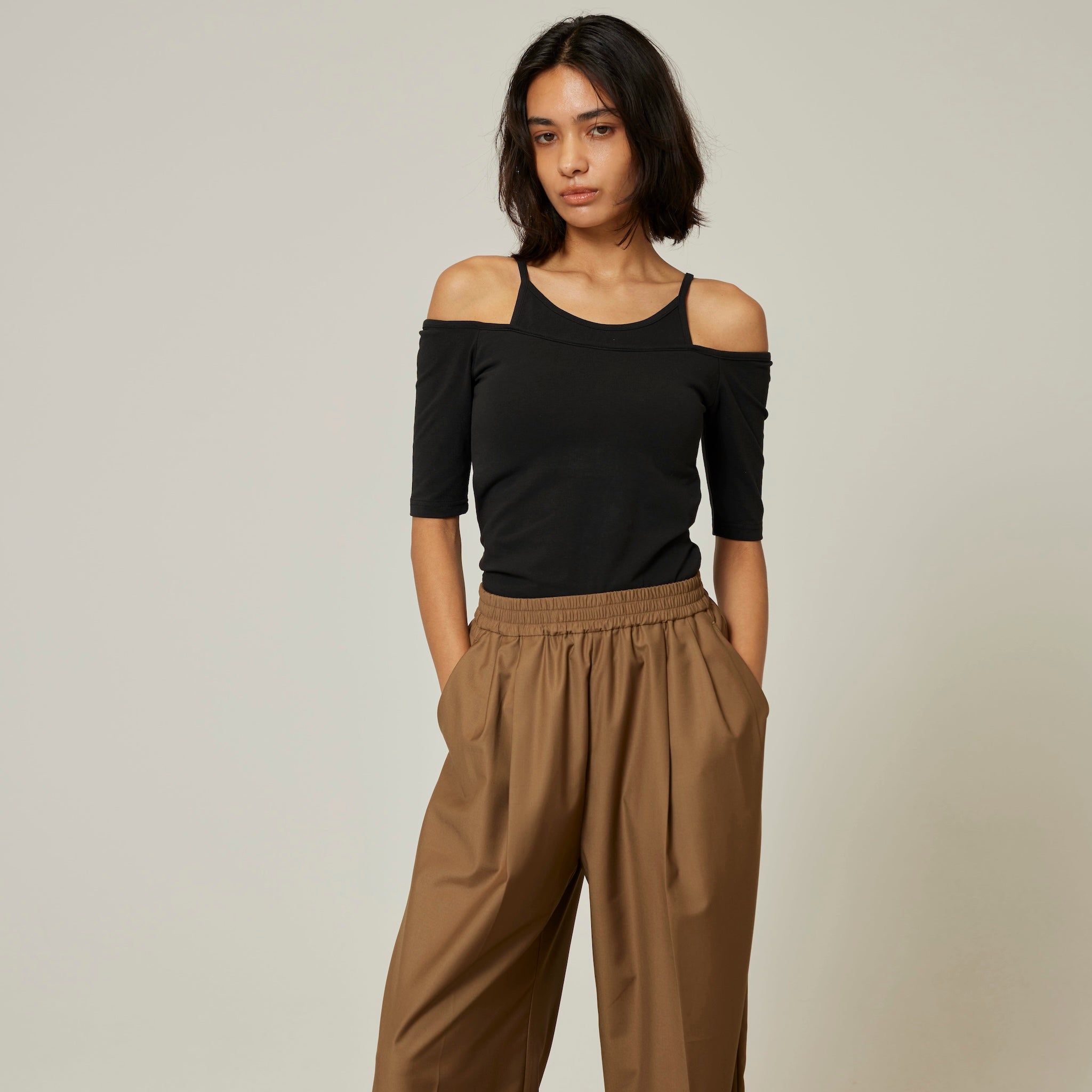 Smooth touch pad in layered half tops