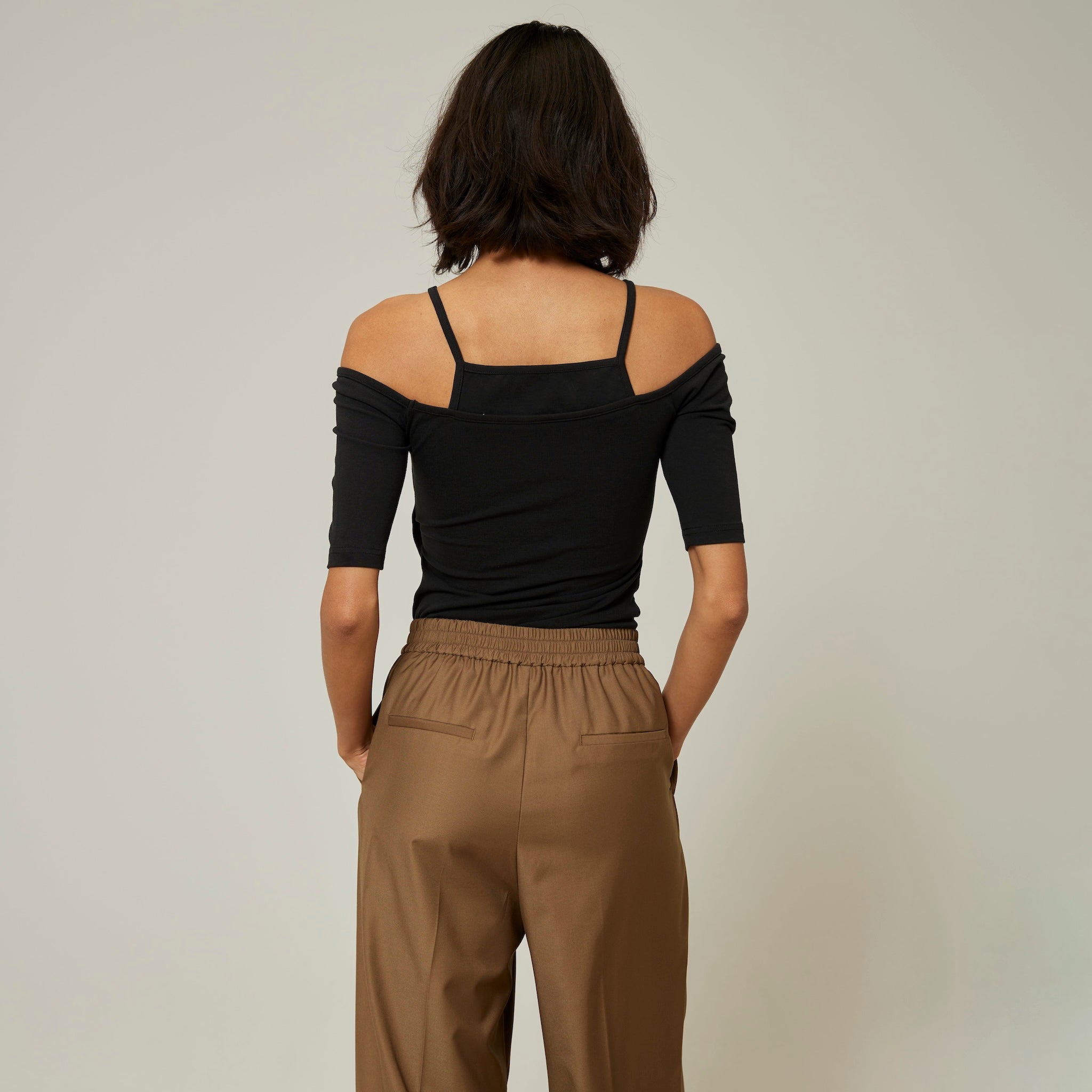 Smooth touch pad in layered half tops