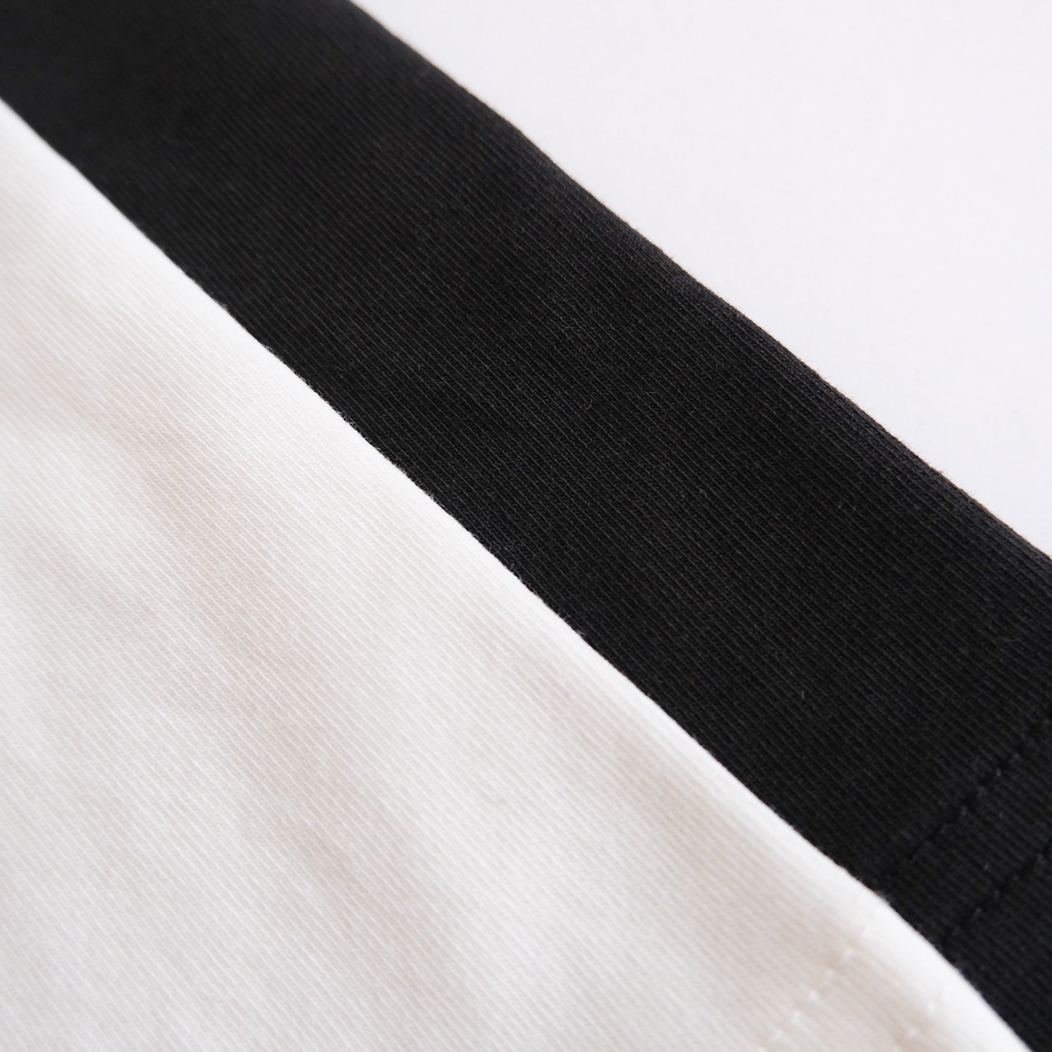 Smooth touch pad in layered half tops