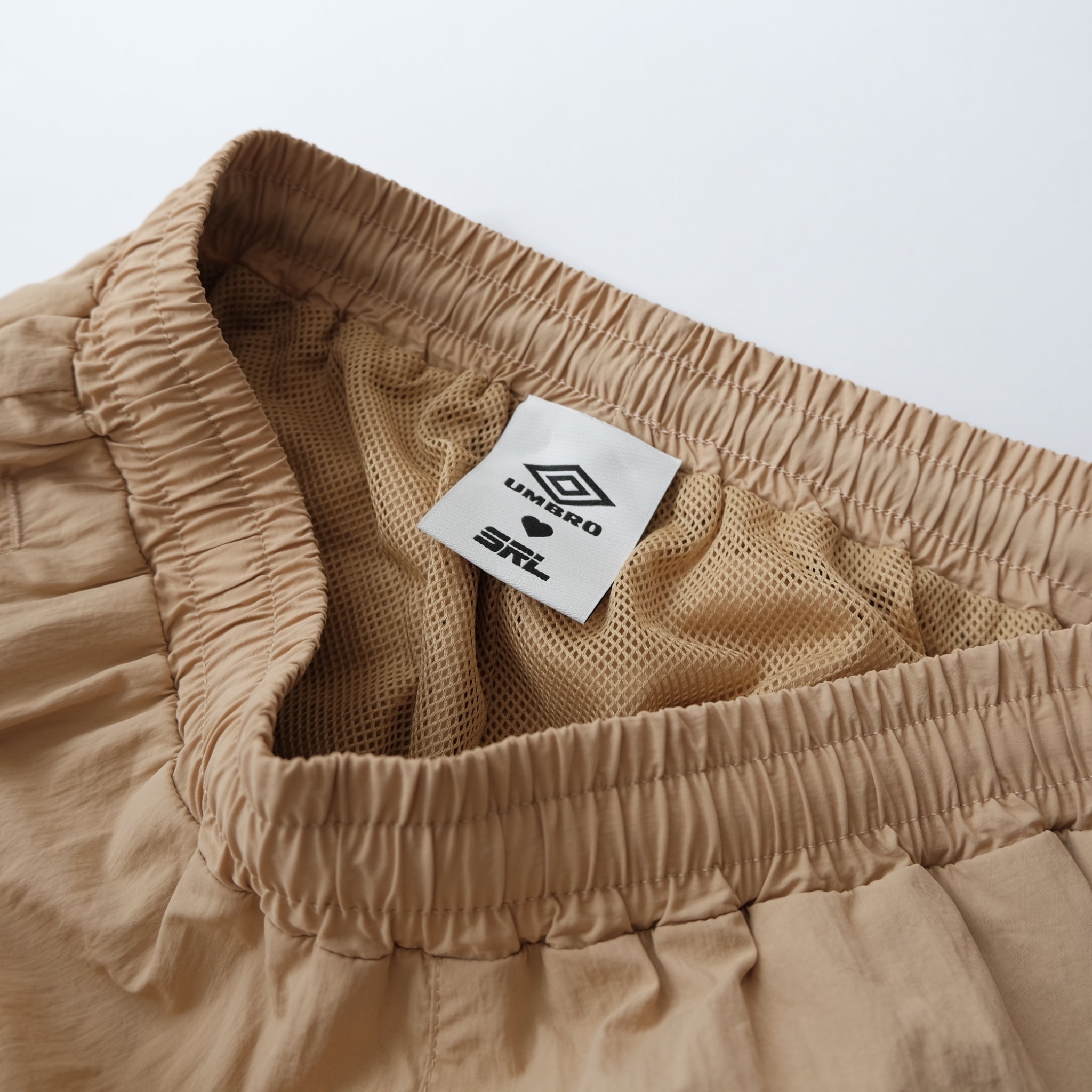 UMBRO x SRL ナイロントラックパンツ