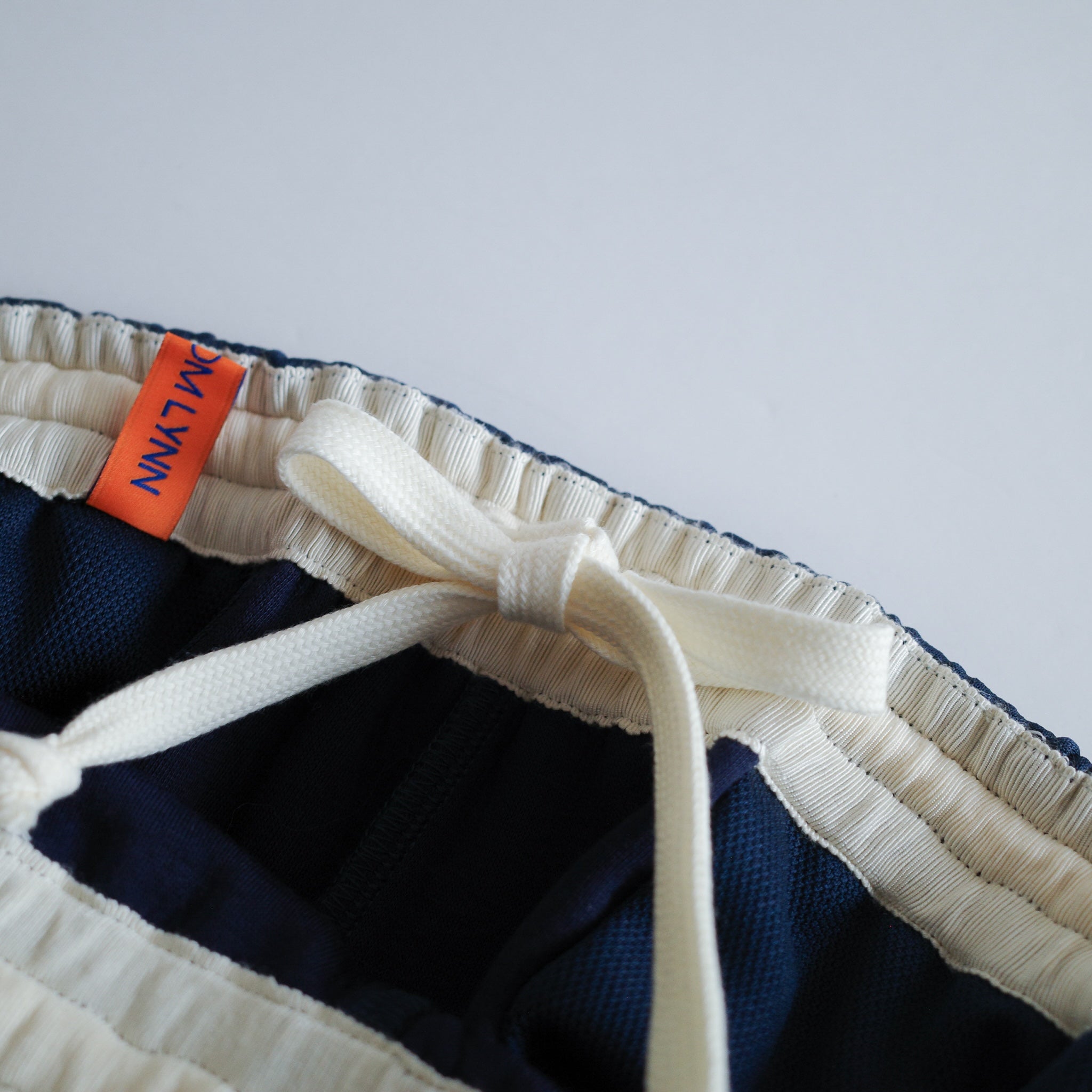 collab Asymmetry Line Trackpants